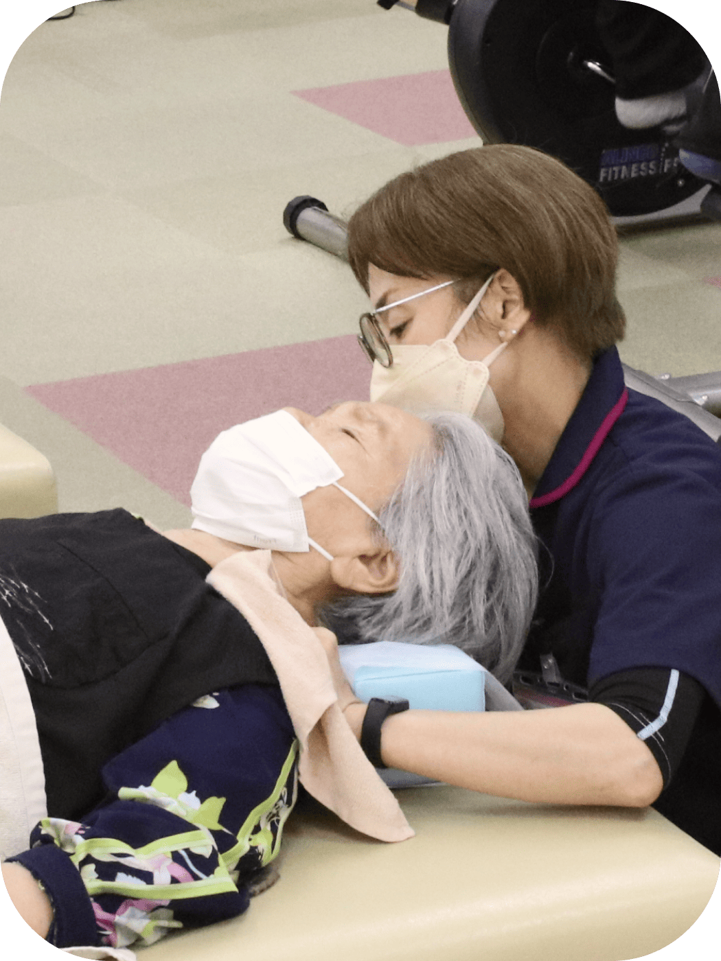 Picture of an employee massaging the shoulder of a client